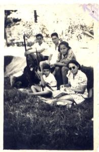 Walter sitting on the ground next to his mother. Photo taken just prior to outbreak of war when guns were commonplace but with stringent conditions placed on their use, including training.